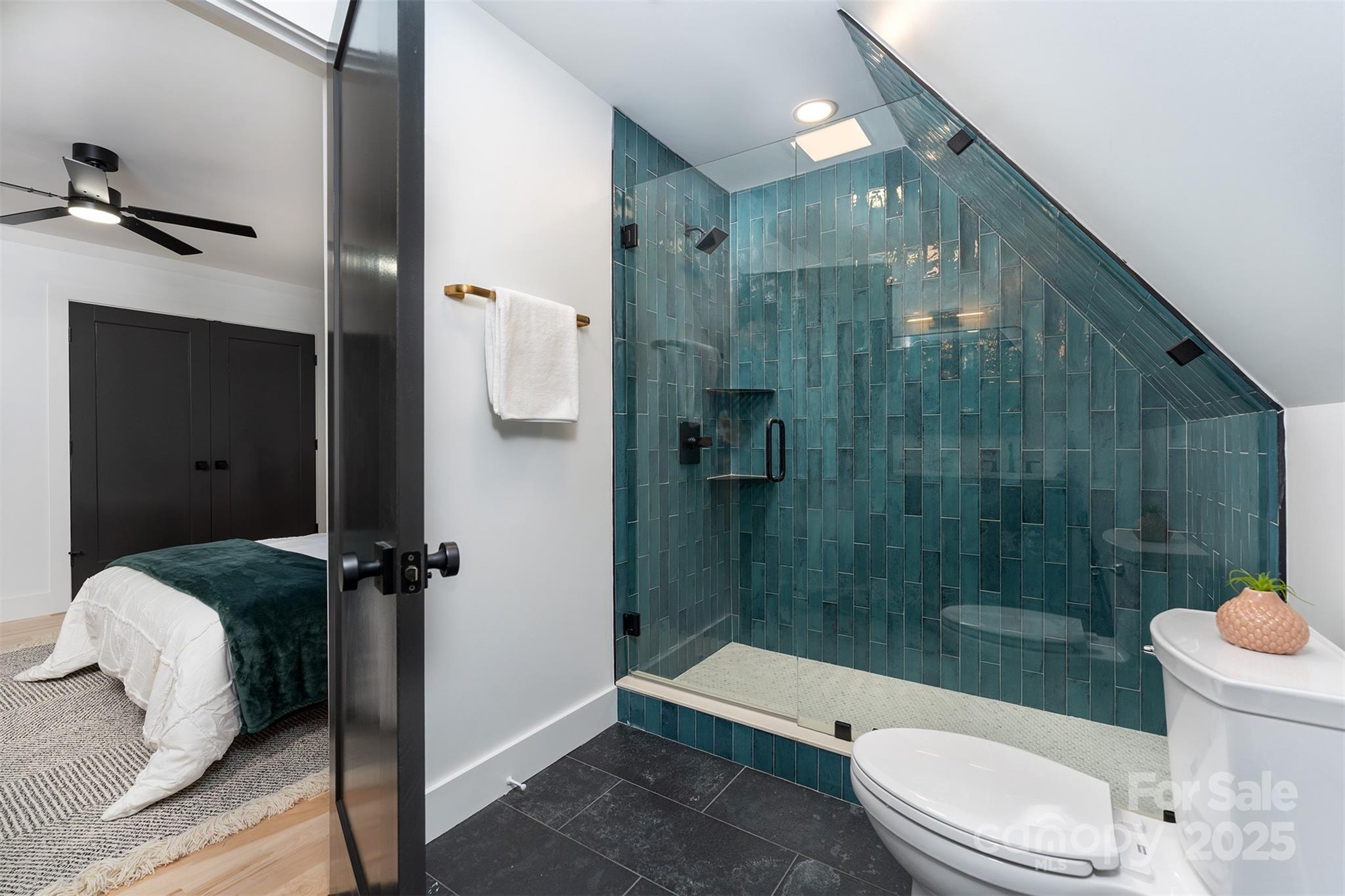 110 Providence Road Asheville, NC 28806 - Photo 19 of 36 a bathroom with a toilet a sink and shower