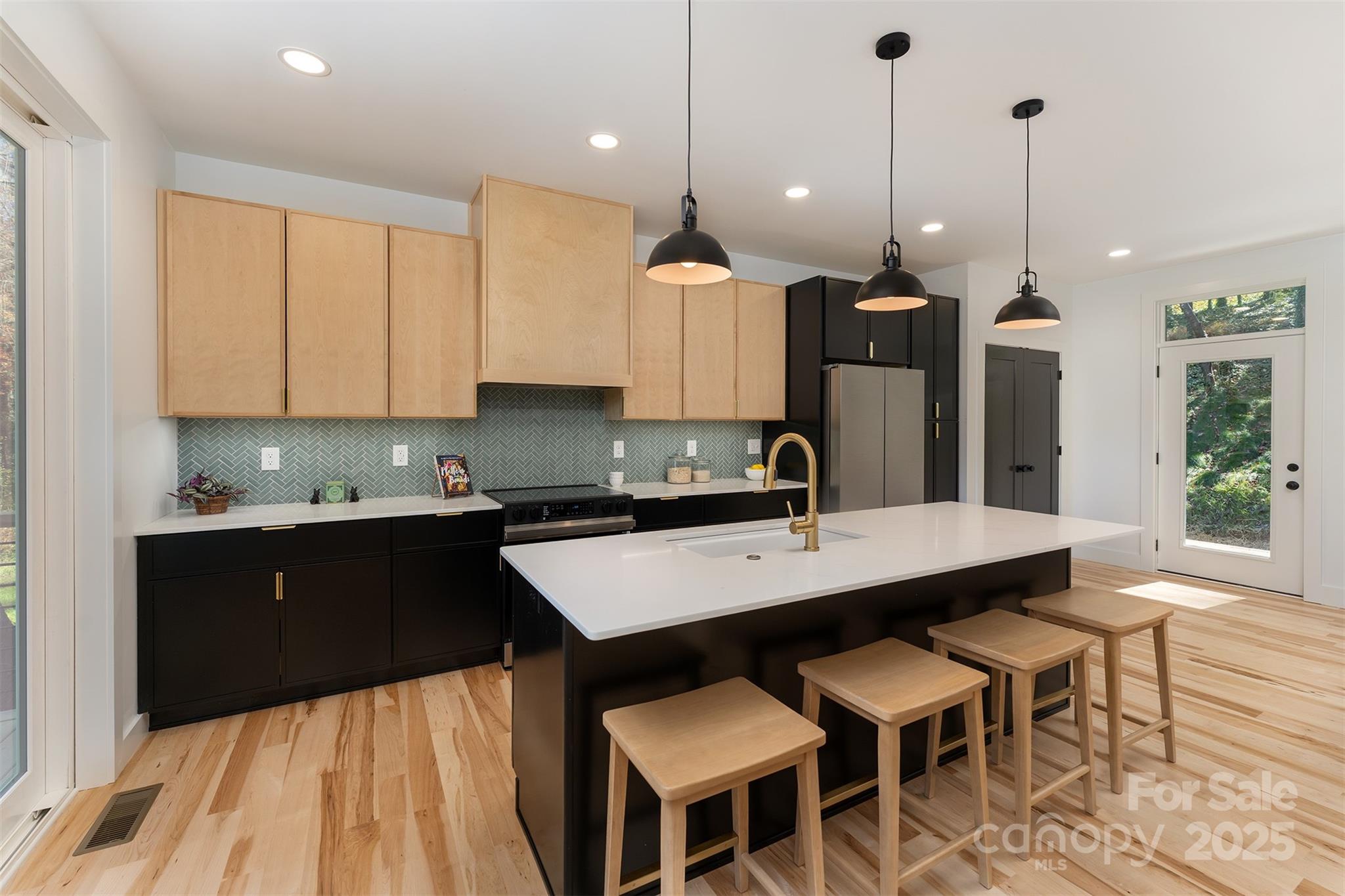 110 Providence Road Asheville, NC 28806 - Photo 2 of 36 a kitchen with a table chairs sink and cabinets