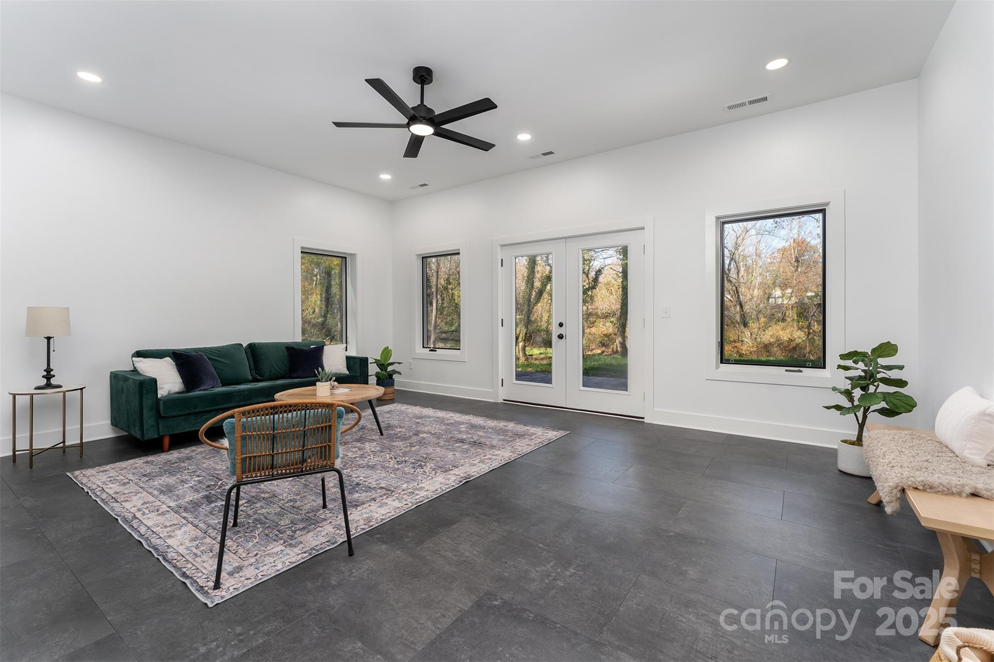 110 Providence Road Asheville, NC 28806 - Photo 25 of 36 a living room with furniture and a wooden floor