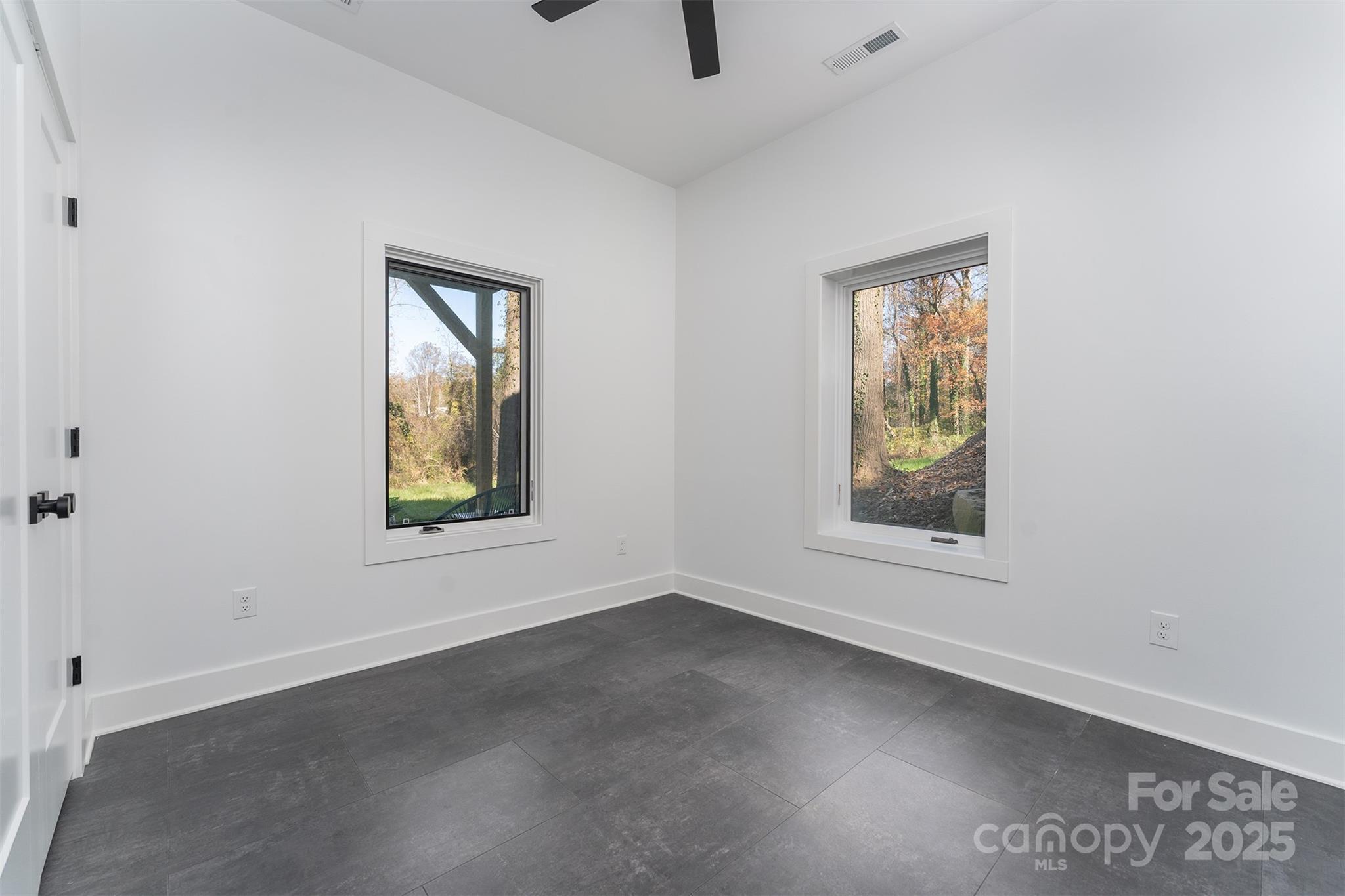 110 Providence Road Asheville, NC 28806 - Photo 31 of 36 an empty room with windows