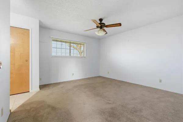 a view of a big room with carpet