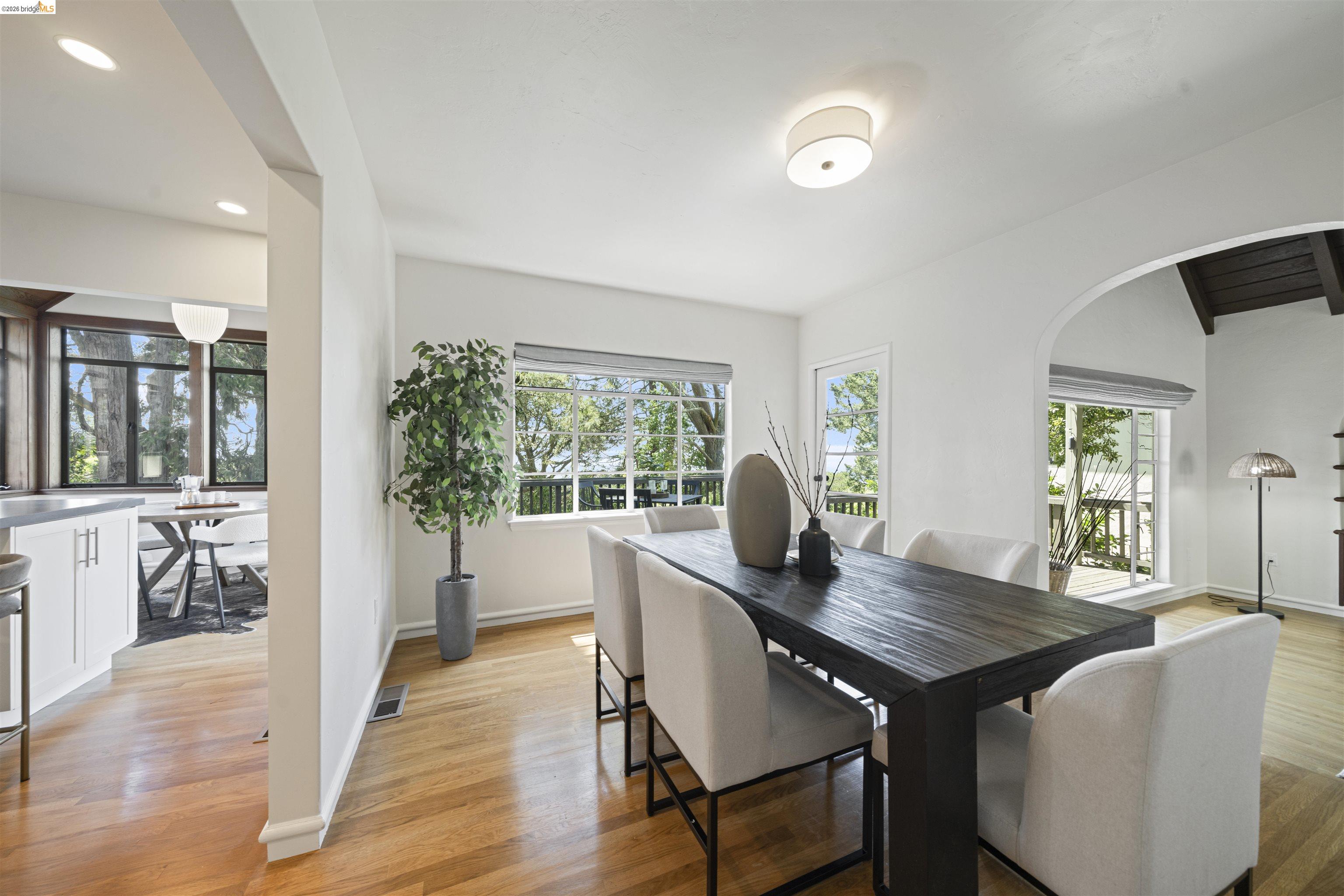 1170 Sterling Avenue Berkeley, CA 94708 - Photo 8 of 52 Dining space featuring light wood-style flooring, arched walkways, plenty of natural light, and recessed lighting