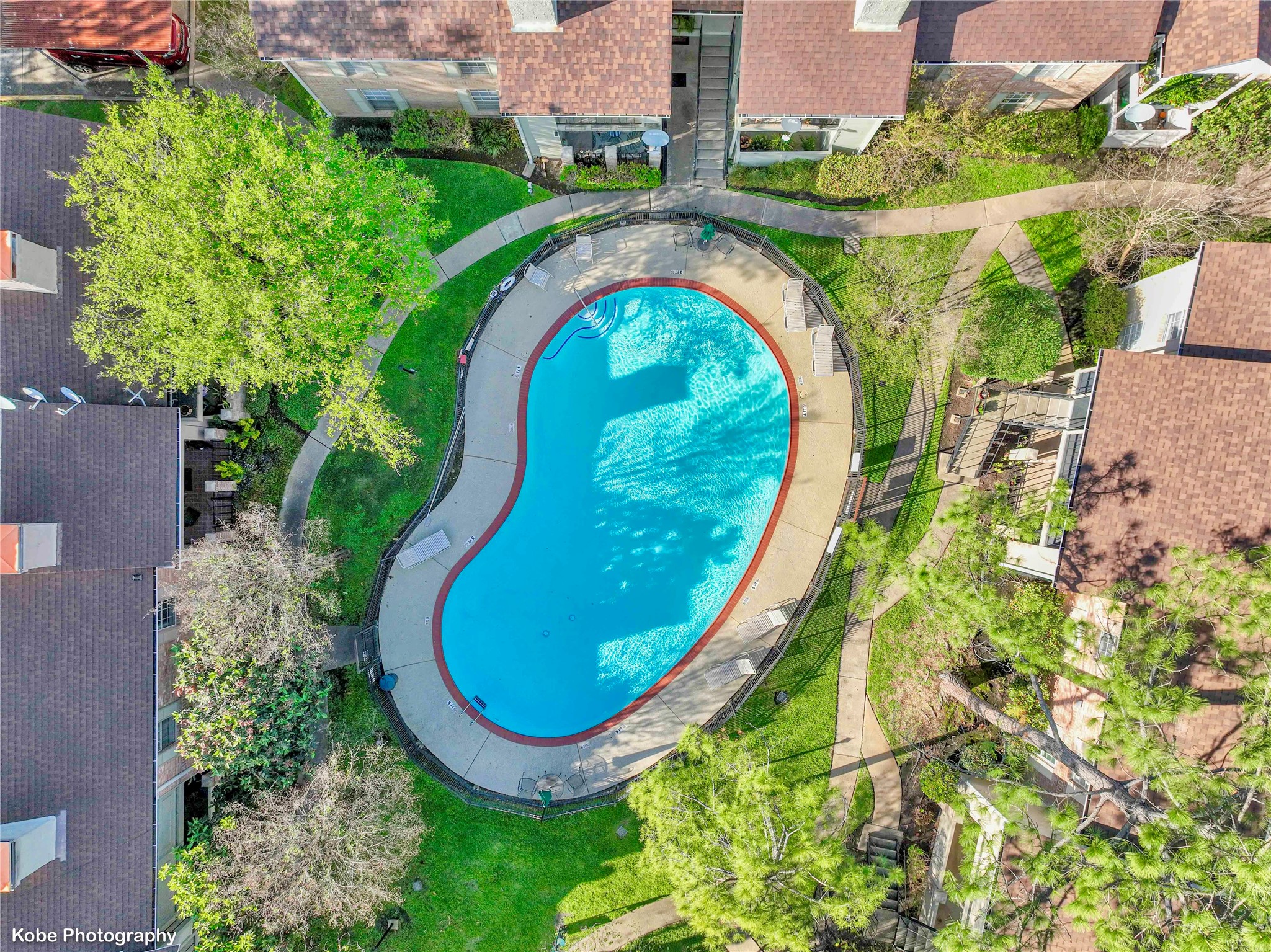2800 Jeanetta Street, Unit 910 Houston, TX 77063 - Photo 2 of 6 an aerial view of a swimming pool with outdoor seating and yard