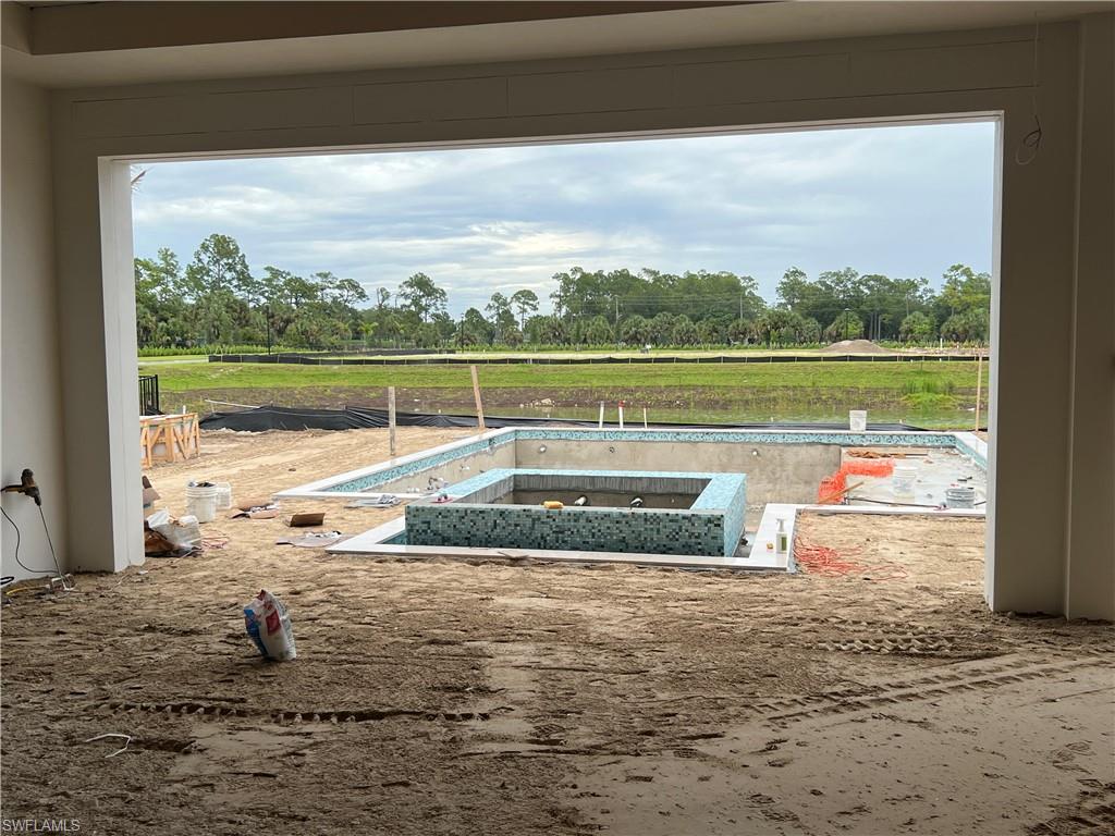 944 Chimney Rock Road Naples, FL 34120 - Photo 13 of 20 a view of swimming pool with a yard