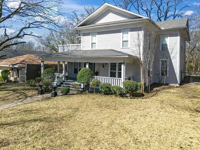 a view of a house with backyard porch and sitting area