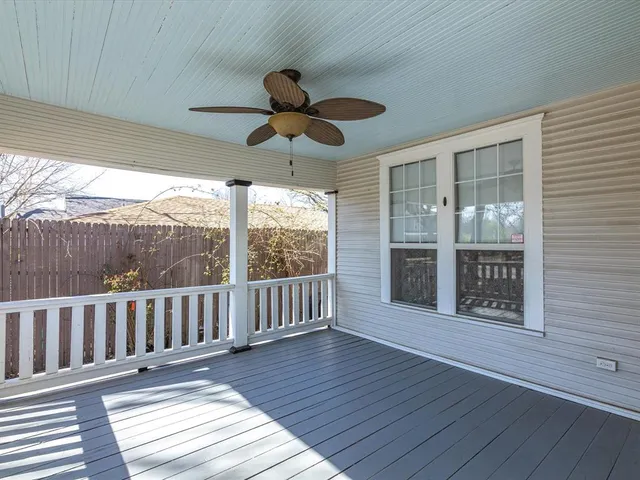 a view of a porch with wooden floor