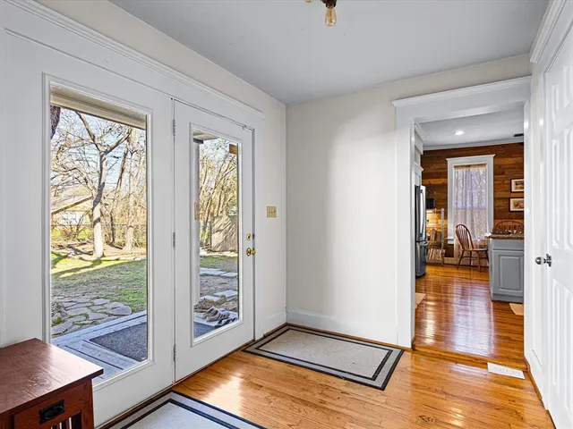 a living room with furniture a flat screen tv and a rug