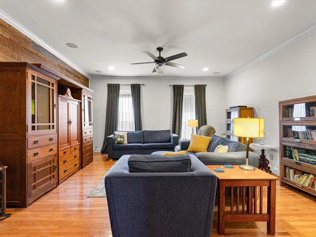 a bed room with furniture and wooden floor