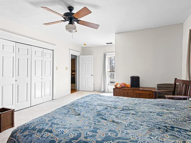 a bedroom with furniture and a window