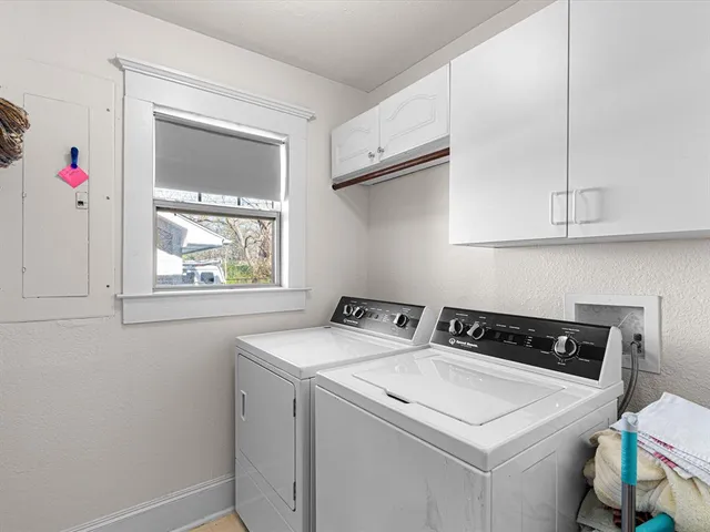 a view of a patio with table and chairs with wooden fence