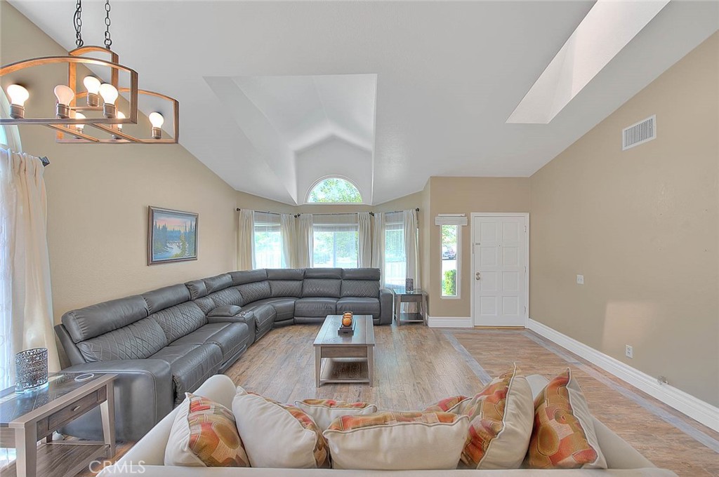 3340 May Court Riverside, CA 92503 - Photo 11 of 67 a living room with furniture and a large mirror