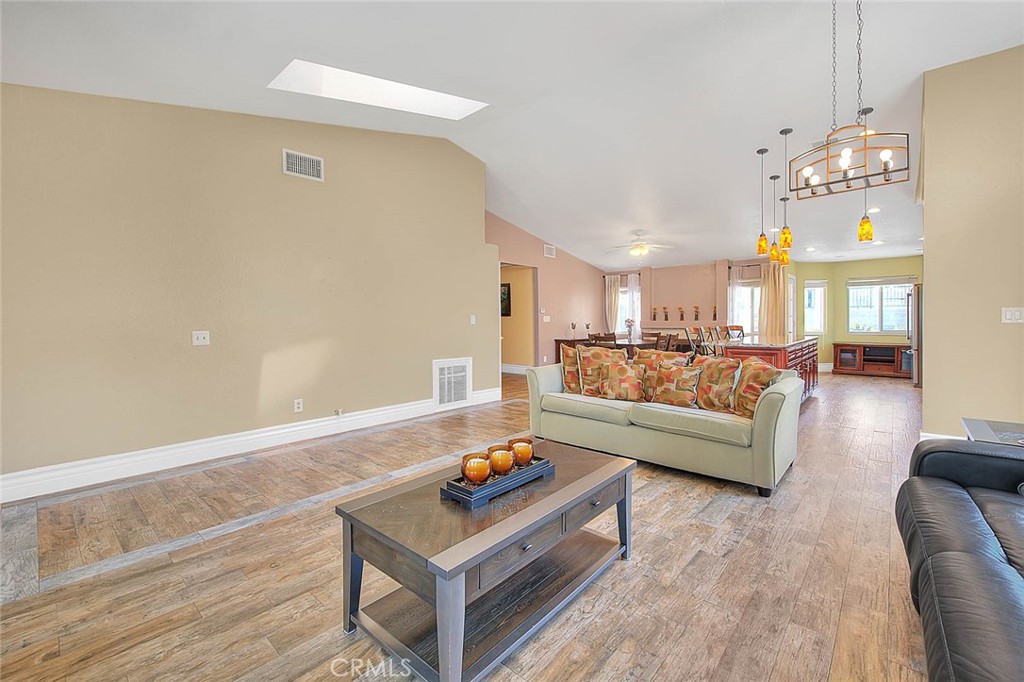 3340 May Court Riverside, CA 92503 - Photo 12 of 67 a living room with furniture and a chandelier