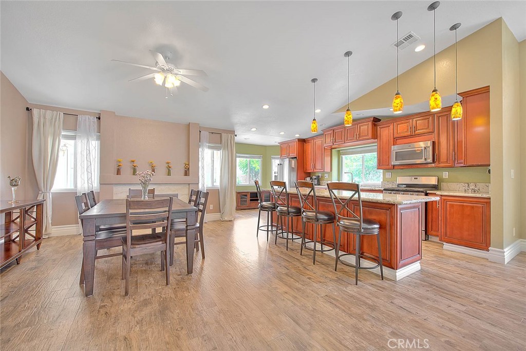 3340 May Court Riverside, CA 92503 - Photo 14 of 67 a view of a dining room with furniture window and wooden floor