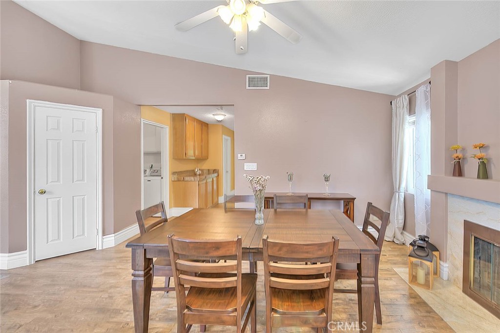 3340 May Court Riverside, CA 92503 - Photo 24 of 67 a view of a dining room with furniture and wooden floor