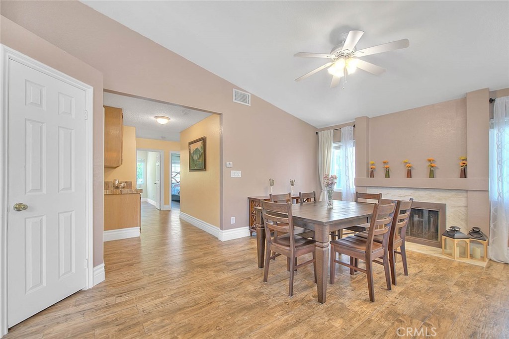 3340 May Court Riverside, CA 92503 - Photo 25 of 67 a view of a dining room with furniture and wooden floor