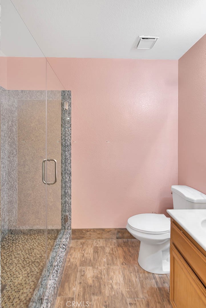 3340 May Court Riverside, CA 92503 - Photo 38 of 67 a bathroom with a granite countertop toilet and a sink