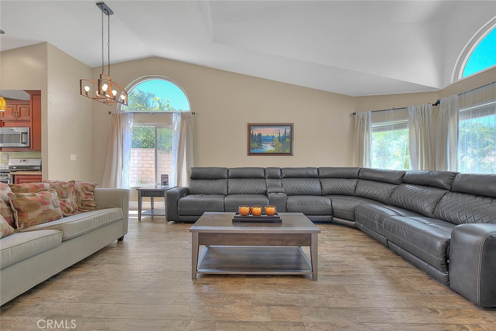 3340 May Court Riverside, CA 92503 - Photo 7 of 67 a living room with furniture and a chandelier