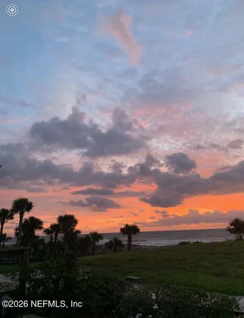 a view of a city with lush green forest