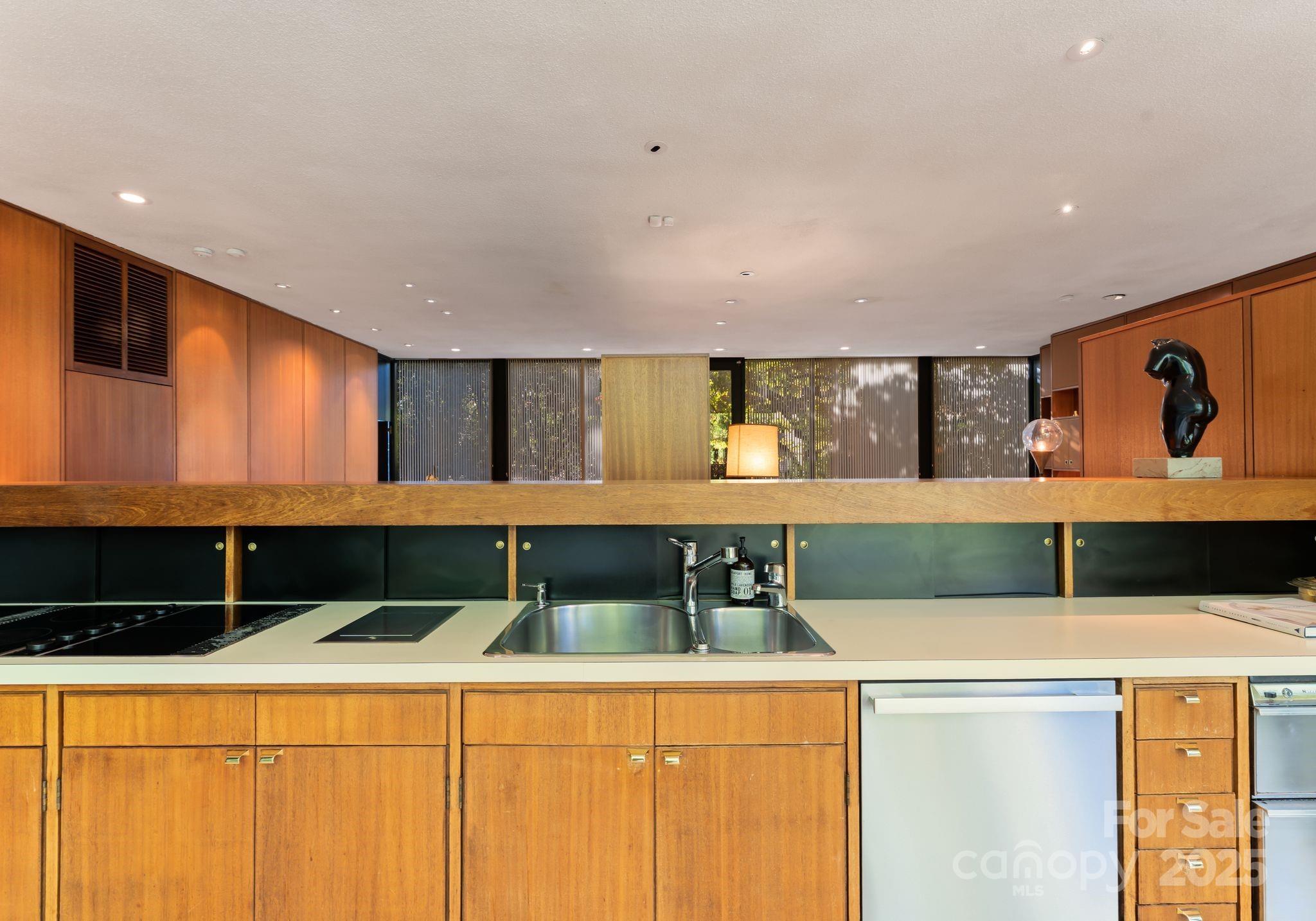 9331 Providence Road Charlotte, NC 28270 - Photo 14 of 40 a bathroom with a double vanity sink and a mirror