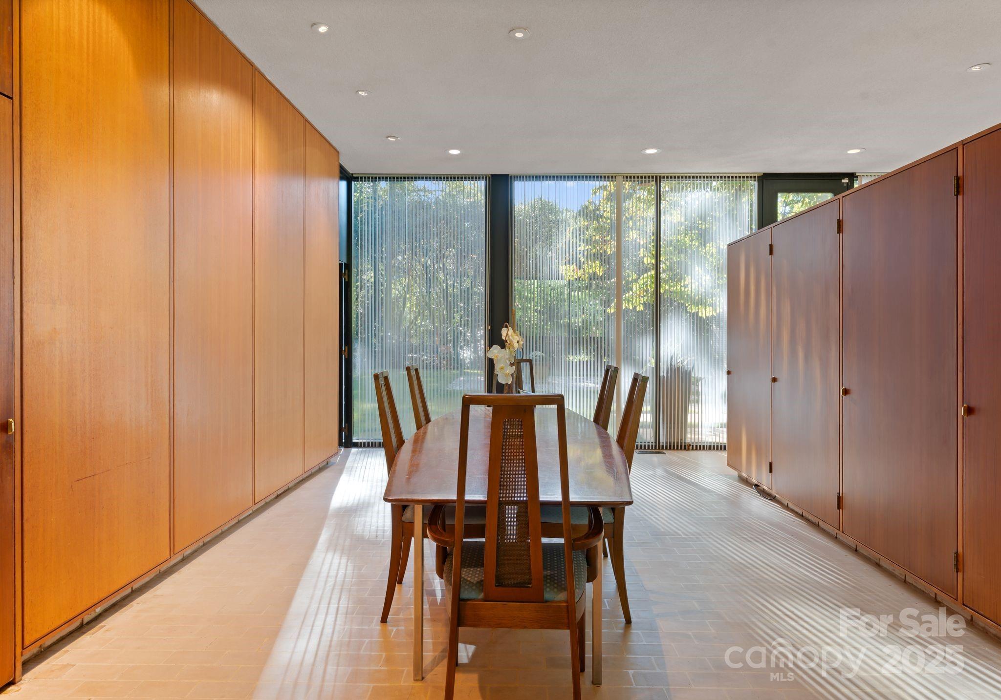 9331 Providence Road Charlotte, NC 28270 - Photo 17 of 40 a view of a dining room with furniture window and wooden floor