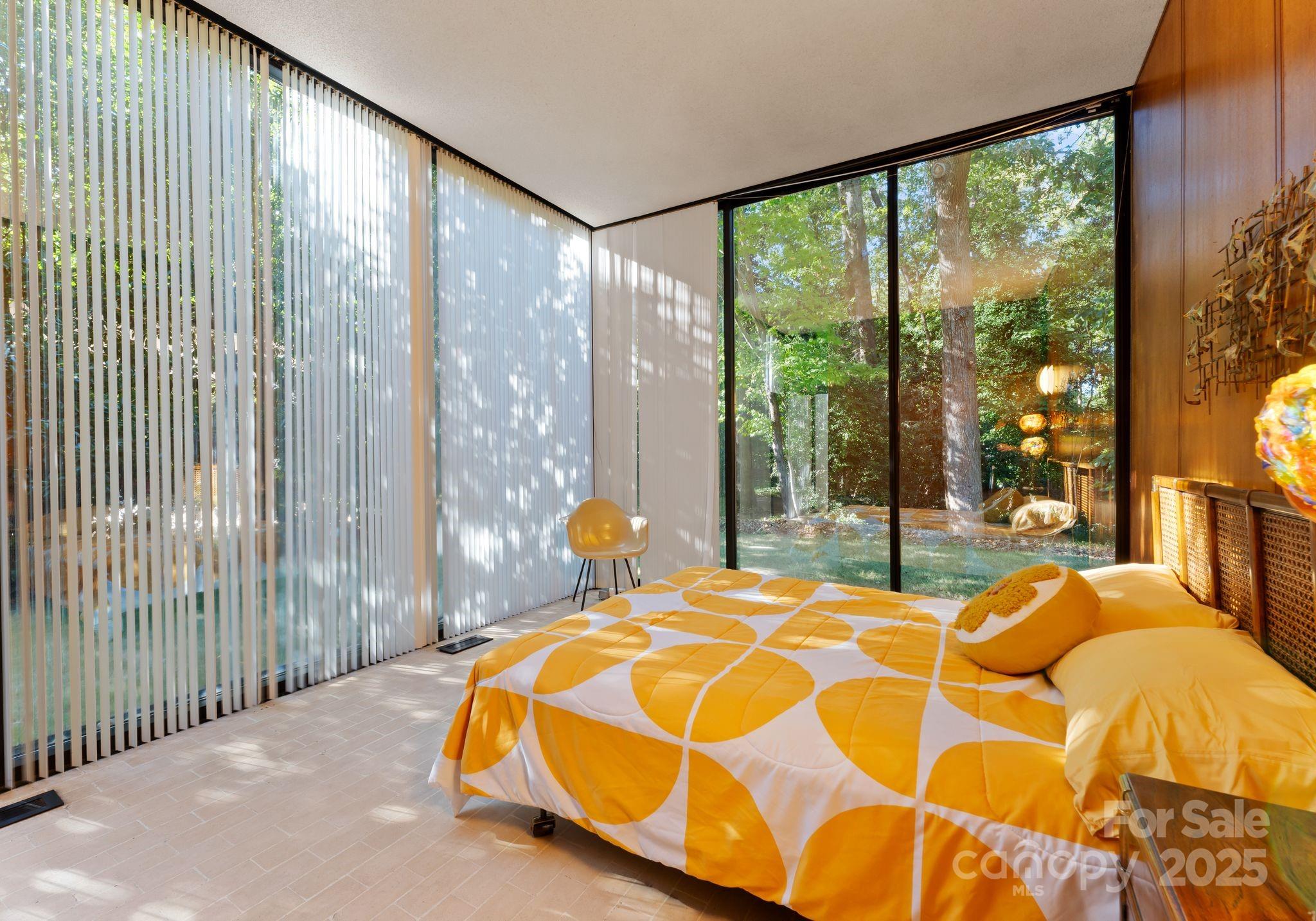 9331 Providence Road Charlotte, NC 28270 - Photo 19 of 40 a bed sitting in a bedroom next to a large window