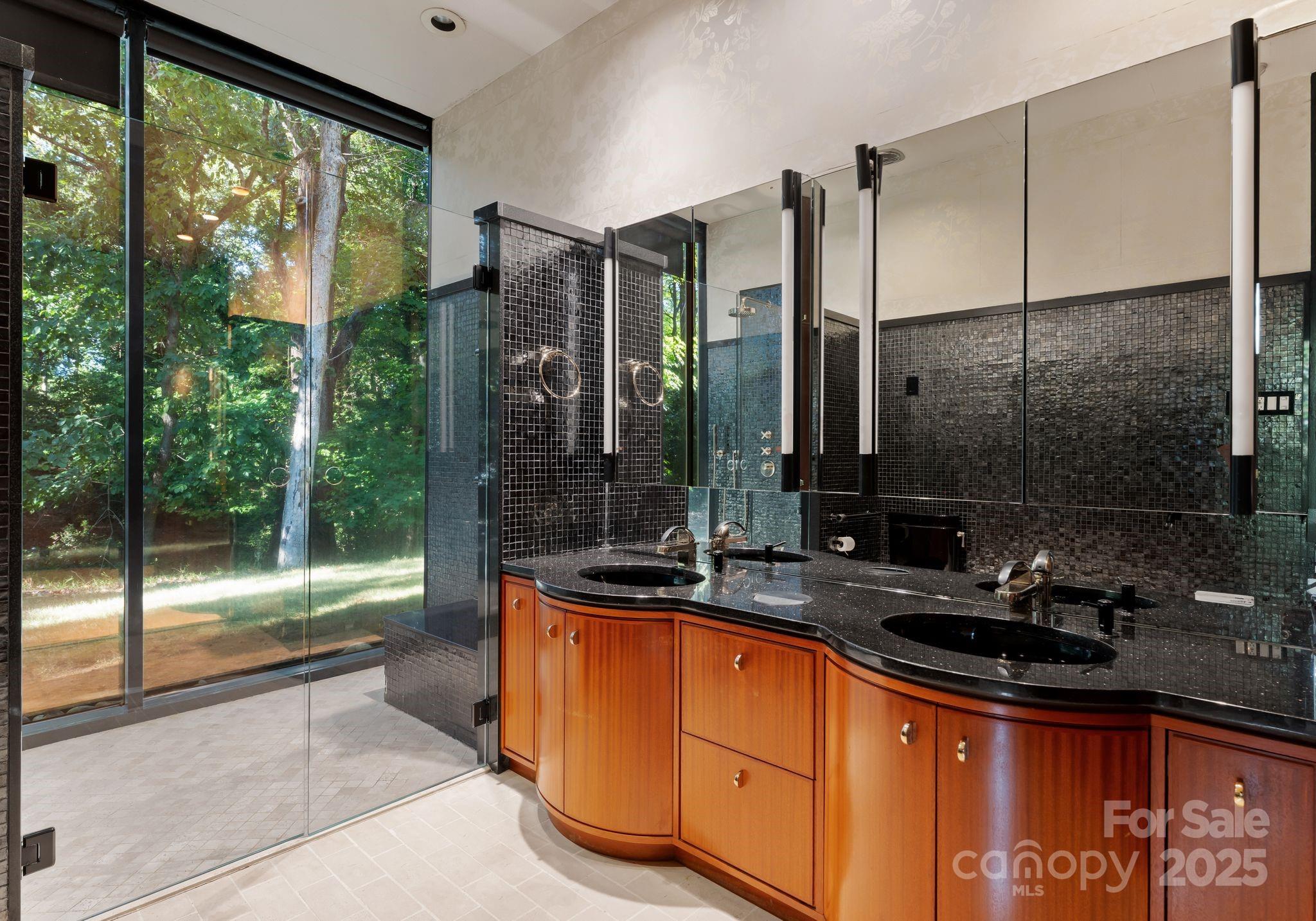 9331 Providence Road Charlotte, NC 28270 - Photo 20 of 40 a bathroom with a sink and a mirror