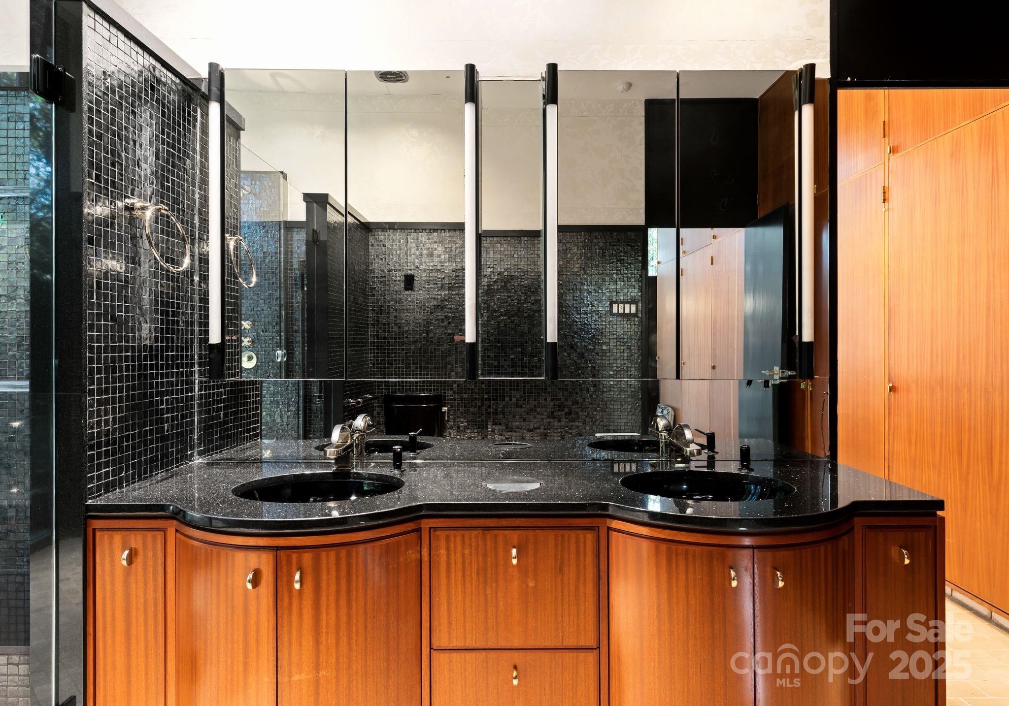 9331 Providence Road Charlotte, NC 28270 - Photo 21 of 40 a bathroom with a sink and a mirror