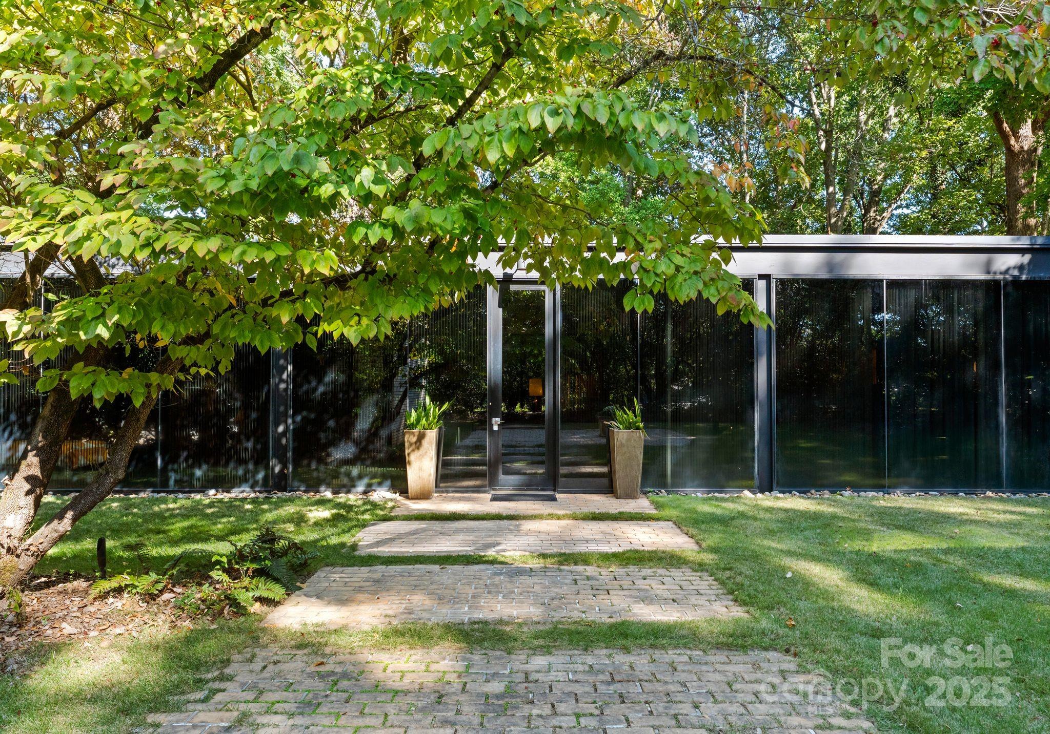9331 Providence Road Charlotte, NC 28270 - Photo 31 of 40 a view of a house with backyard and porch