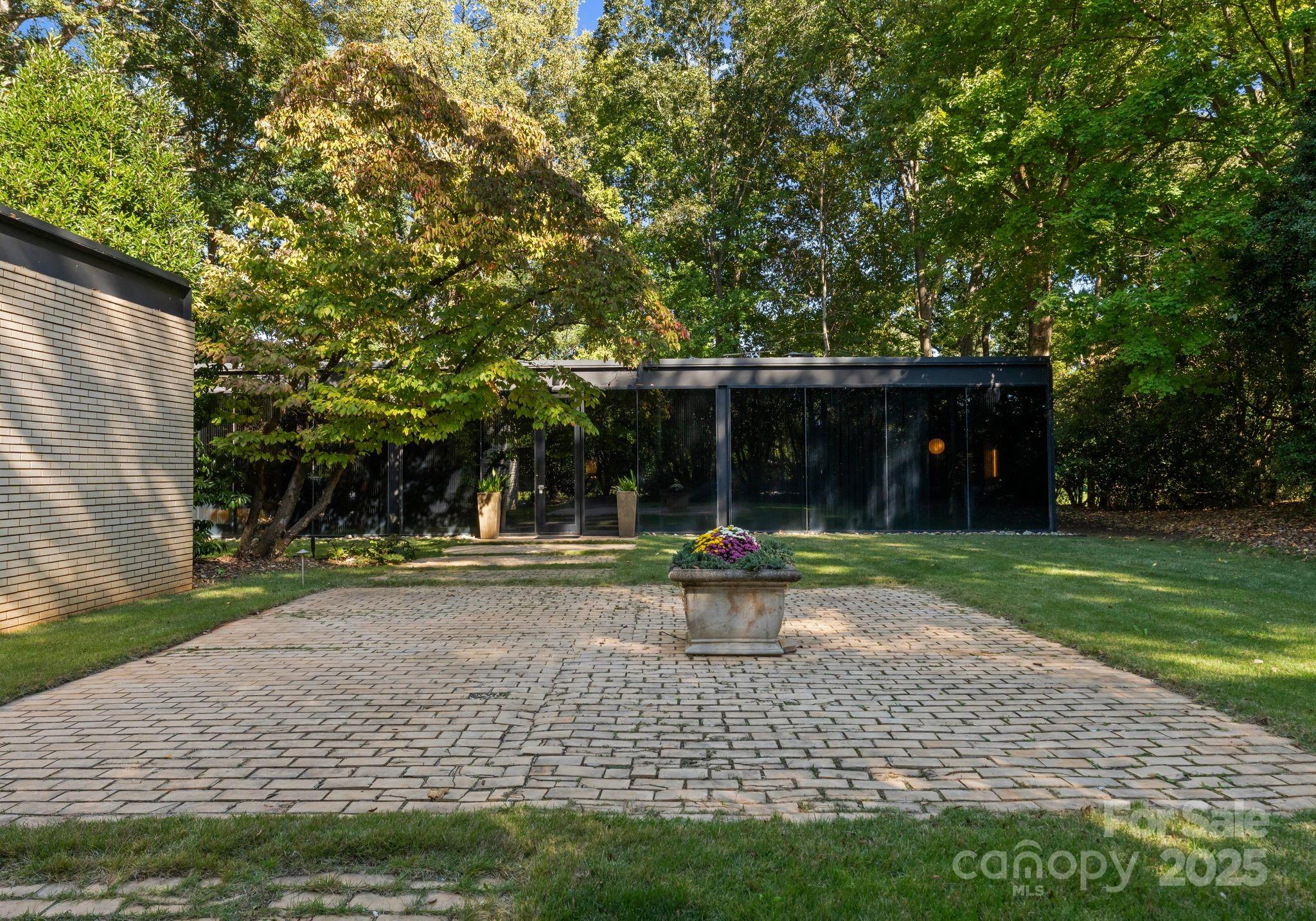 9331 Providence Road Charlotte, NC 28270 - Photo 34 of 40 a view of house with backyard and outdoor seating