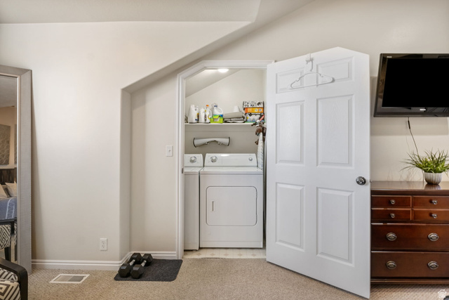 3598 North Huntsman Path, Unit 502 Eden, UT 84310 - Photo 12 of 43 Laundry room with light colored carpet and washing machine and clothes dryer