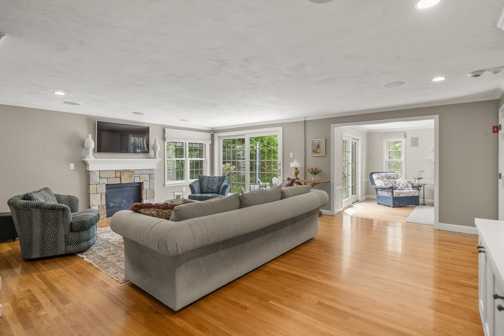 30 Franklin Rodgers Road Hingham, MA 02043 - Photo 12 of 37 a living room with furniture floor to ceiling window and a fireplace