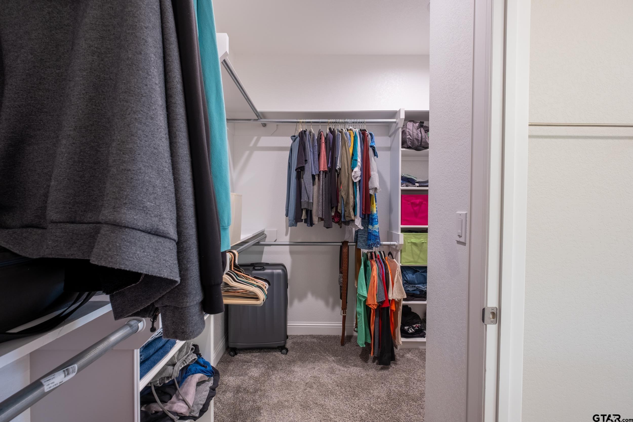 14348 County Road 452 Lindale, TX 75771 - Photo 19 of 45 a view of walk in closet with clothes
