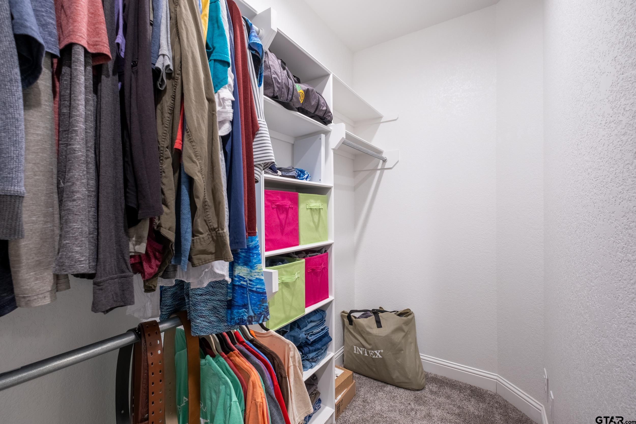 14348 County Road 452 Lindale, TX 75771 - Photo 20 of 45 a view of walk in closet with clothes and shoes