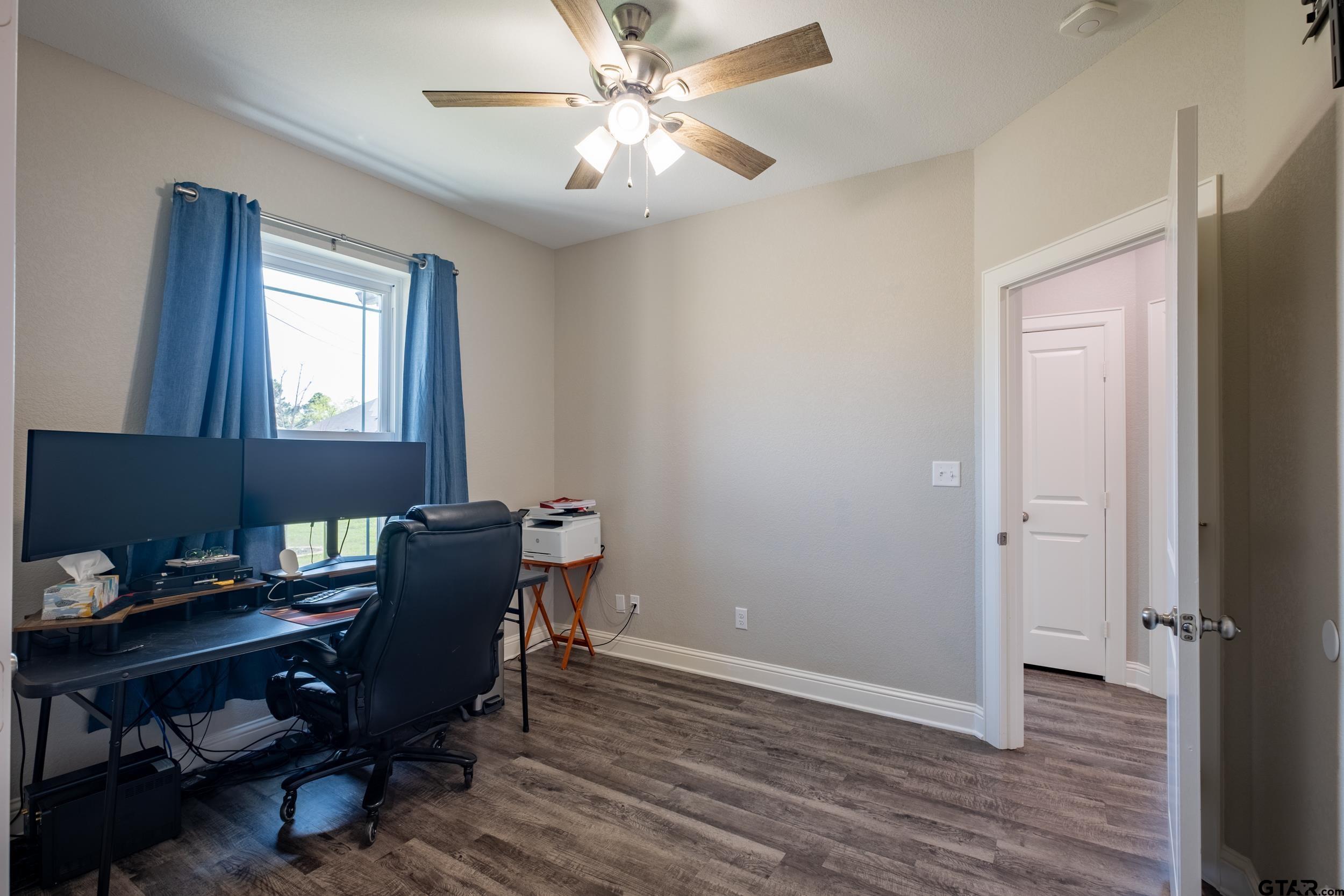 14348 County Road 452 Lindale, TX 75771 - Photo 21 of 45 a view of a workspace with furniture and a window