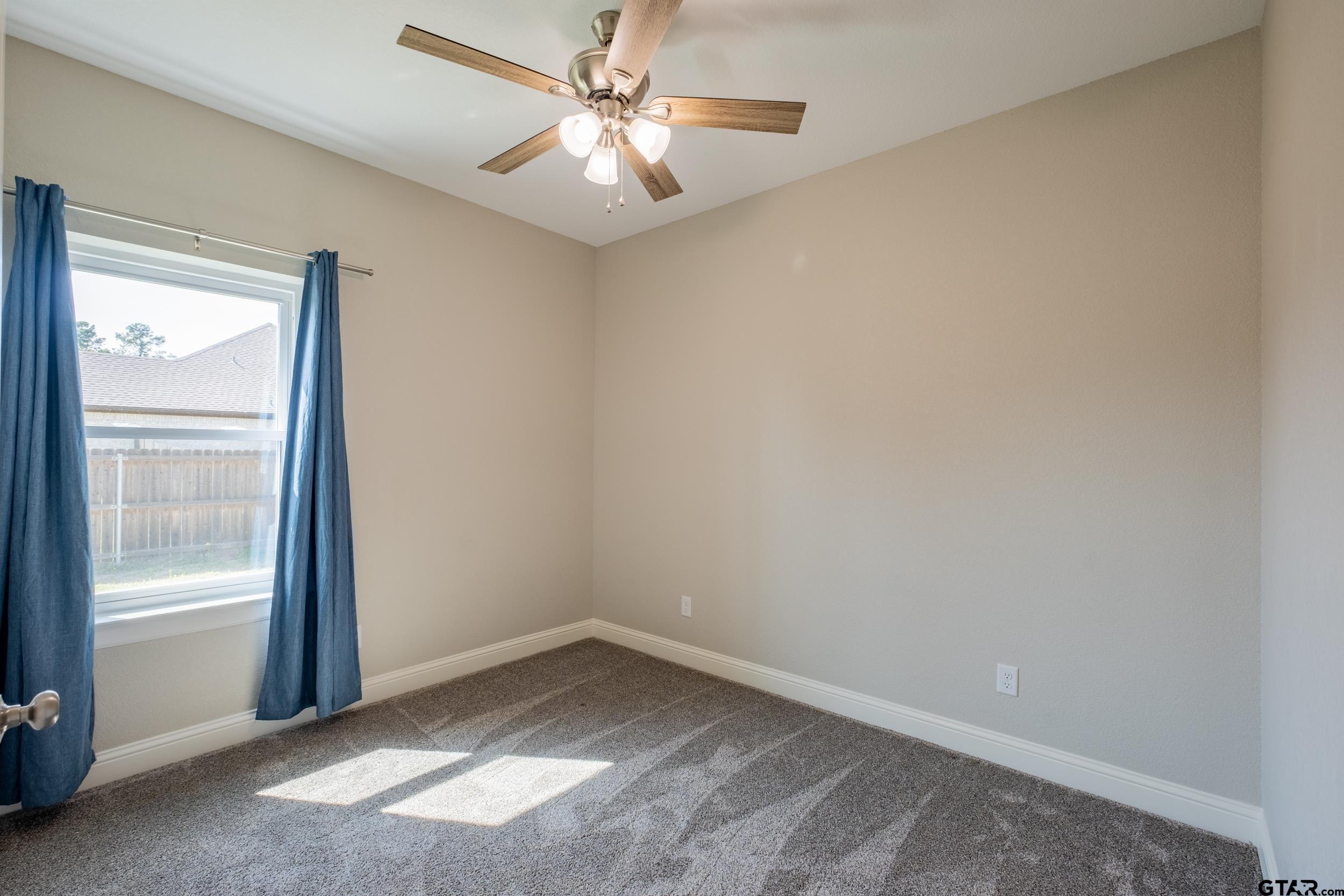 14348 County Road 452 Lindale, TX 75771 - Photo 26 of 45 an empty room with a window and a fan