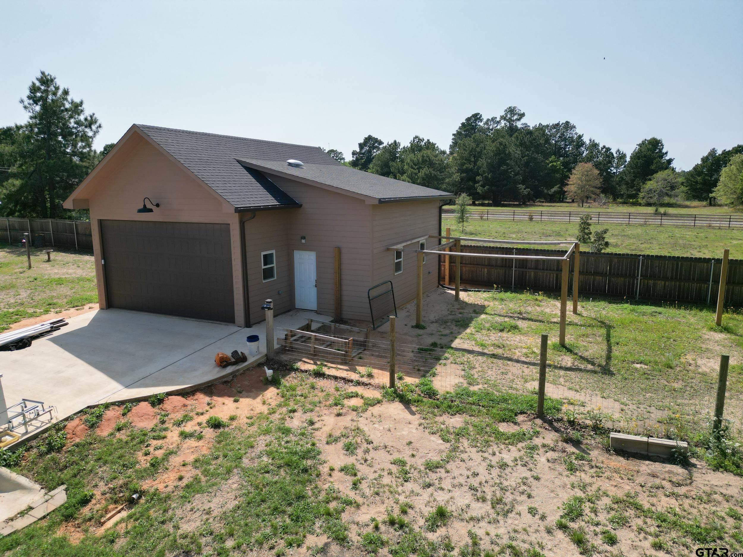 14348 County Road 452 Lindale, TX 75771 - Photo 32 of 45 a backyard of a house with table and chairs