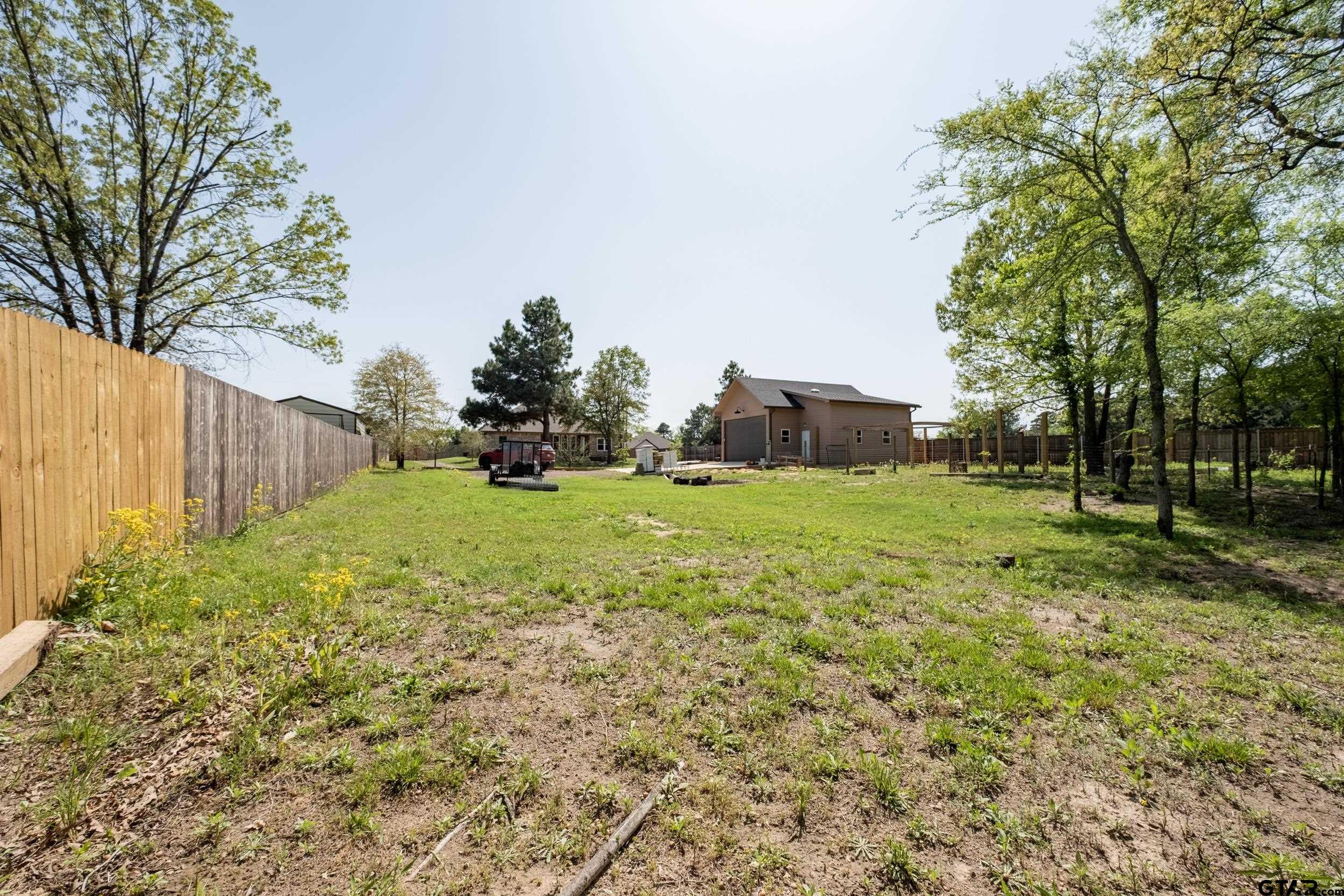 14348 County Road 452 Lindale, TX 75771 - Photo 39 of 45 a view of a backyard with large trees