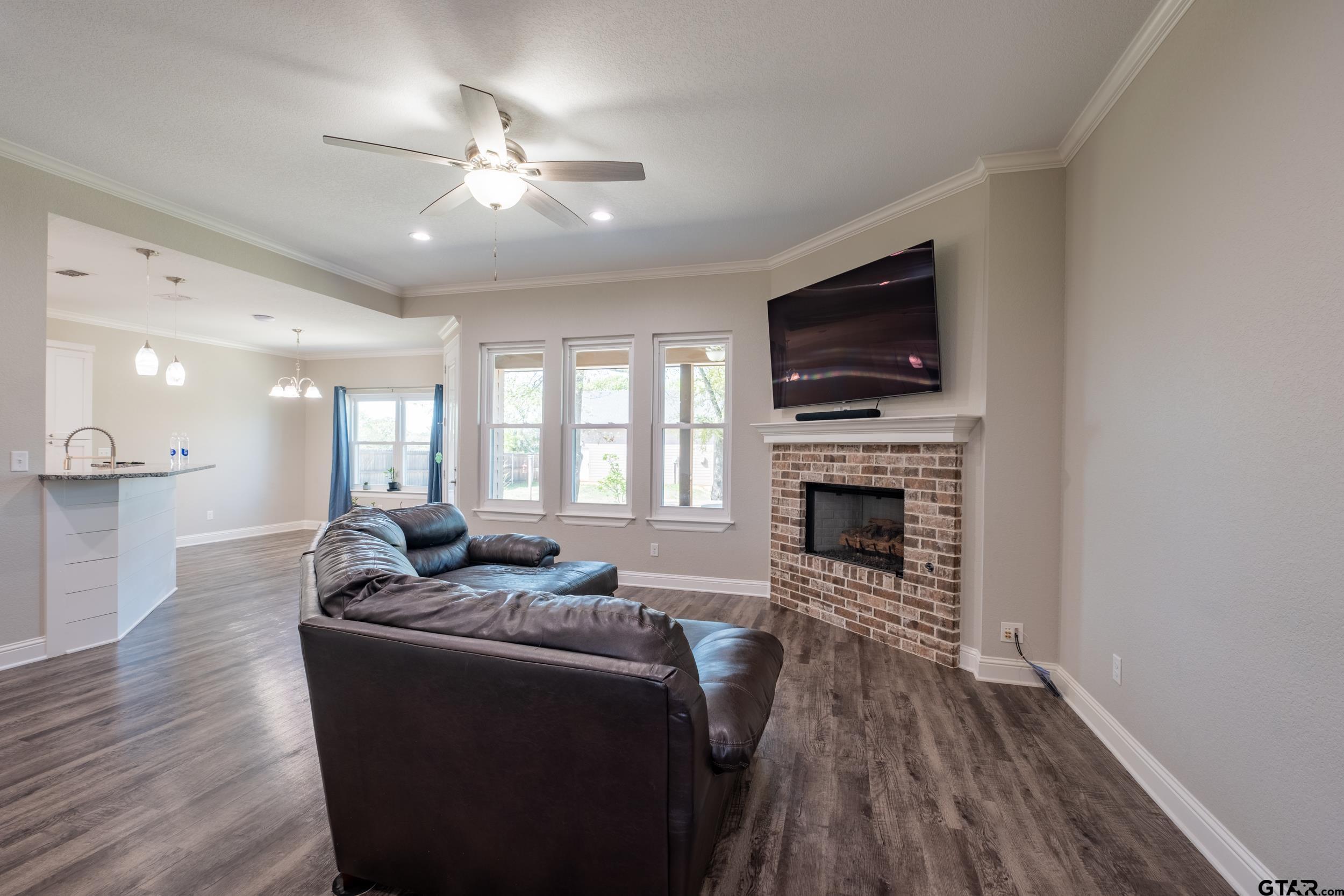14348 County Road 452 Lindale, TX 75771 - Photo 4 of 45 a living room with furniture fireplace and flat screen tv