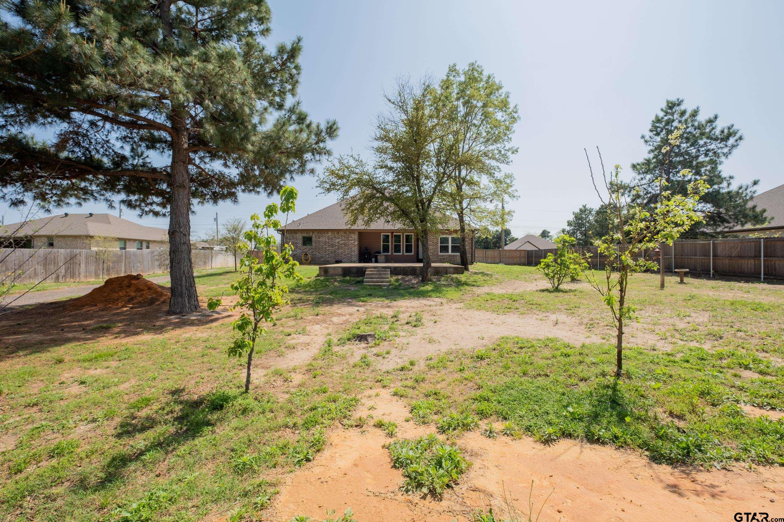 14348 County Road 452 Lindale, TX 75771 - Photo 41 of 45 a view of a yard with yellow house