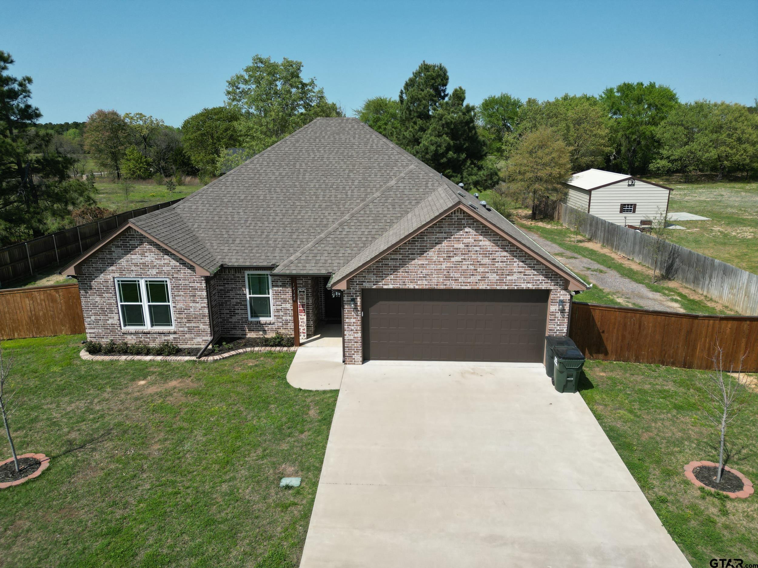 14348 County Road 452 Lindale, TX 75771 - Photo 43 of 45 a house with green field in front of it