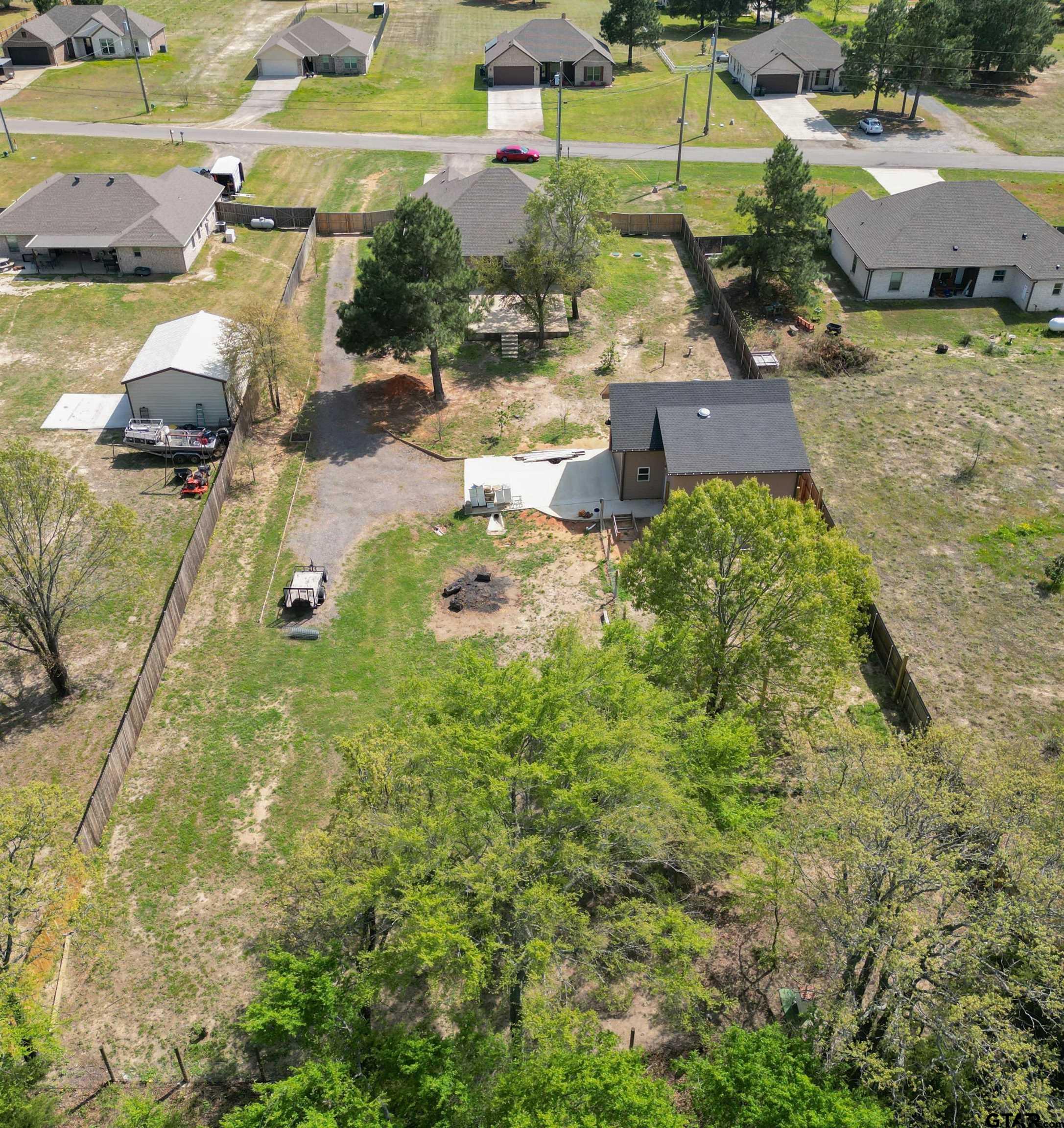 14348 County Road 452 Lindale, TX 75771 - Photo 44 of 45 an aerial view of a house with a yard and lake view