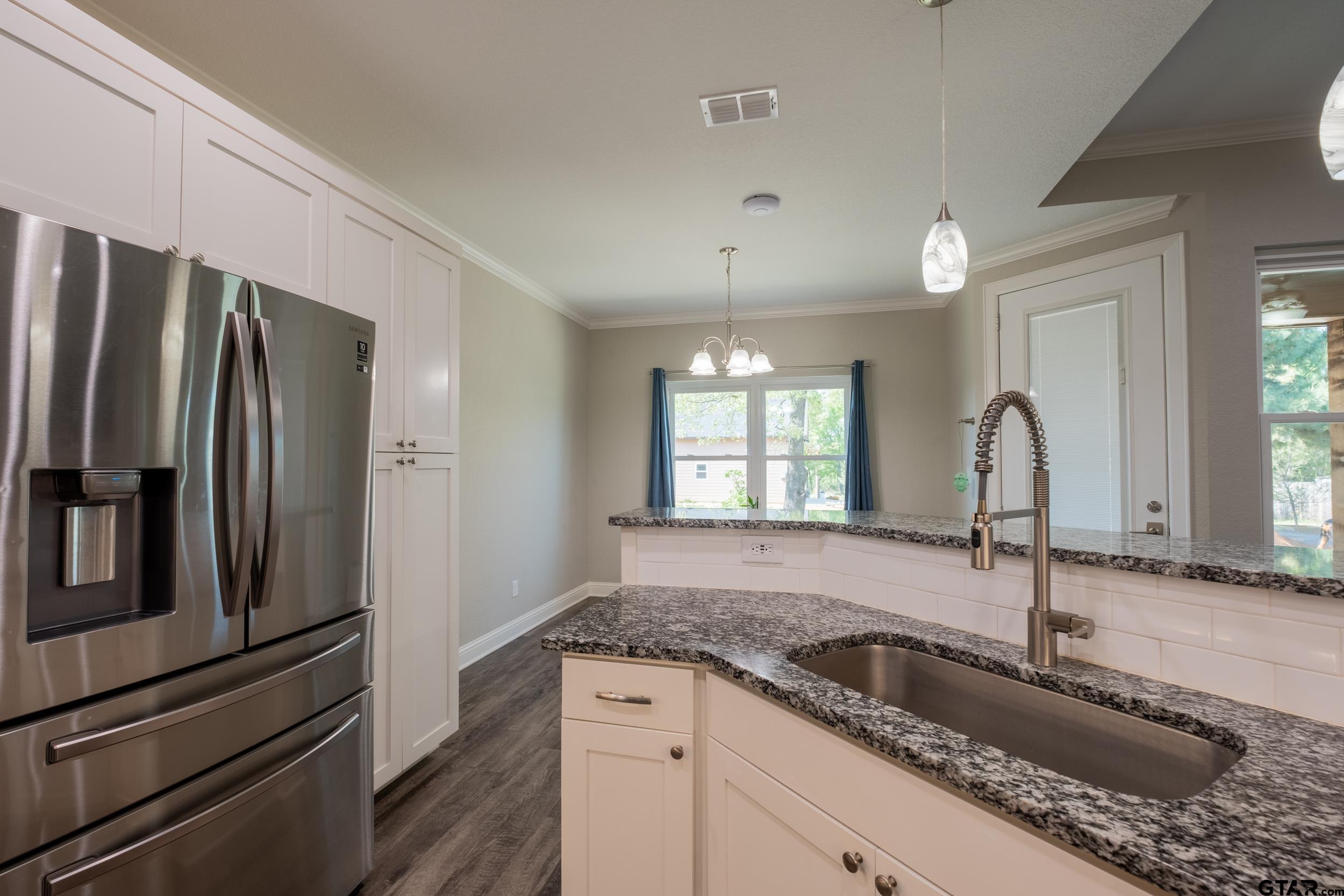 14348 County Road 452 Lindale, TX 75771 - Photo 7 of 45 a kitchen with granite countertop a sink stainless steel appliances and window