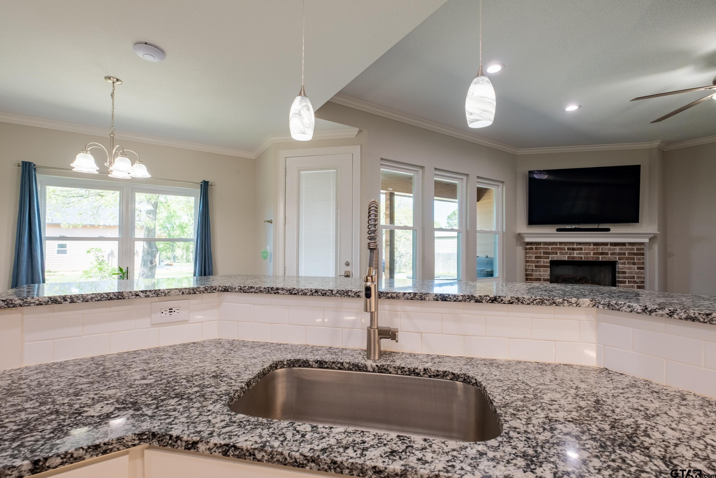 14348 County Road 452 Lindale, TX 75771 - Photo 8 of 45 a view of a kitchen with a sink and a large window