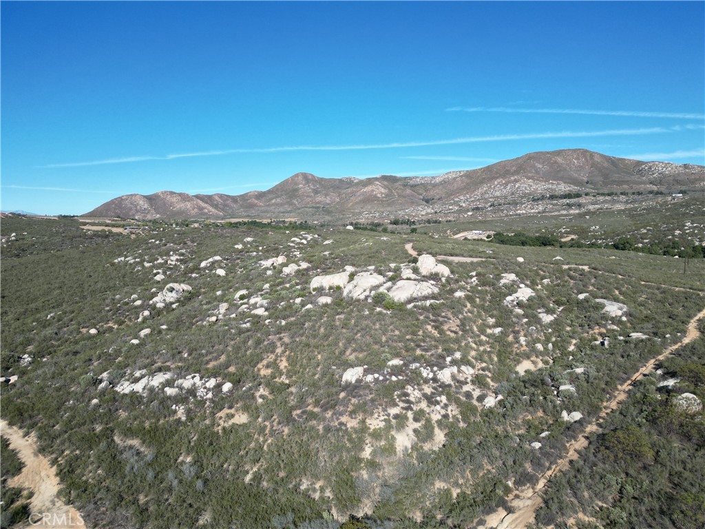 0 East Benton Road Hemet, CA 92544 - Photo 11 of 11 a view of a mountain range in a cloudy sky