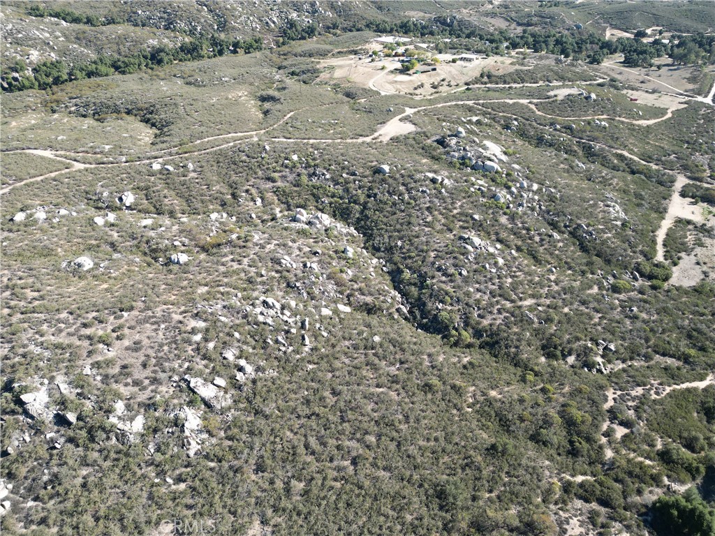 0 East Benton Road Hemet, CA 92544 - Photo 9 of 11 a view of a dry yard with large trees