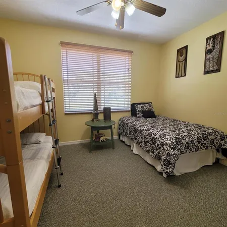 a bed sitting in a room next to a window