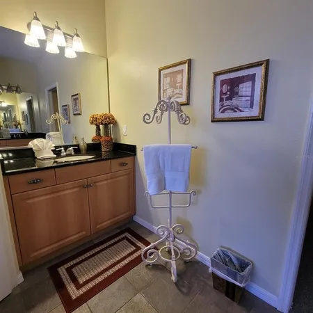 a room with a table chairs and a dresser