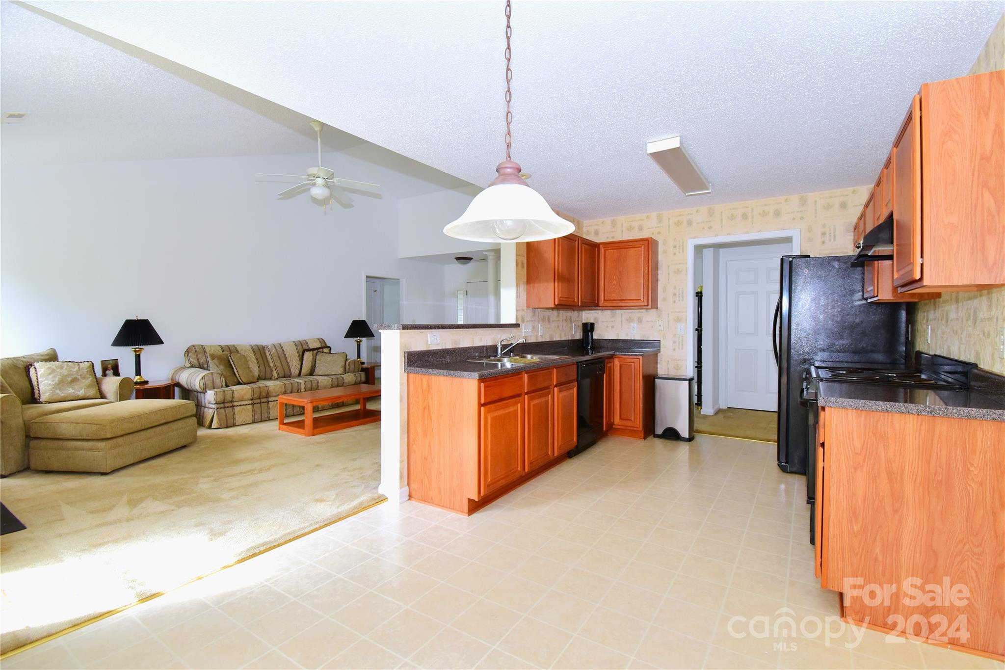 65 Cottage Ridge Road Fletcher, NC 28732 - Photo 14 of 40 a kitchen with stainless steel appliances granite countertop a stove and a refrigerator
