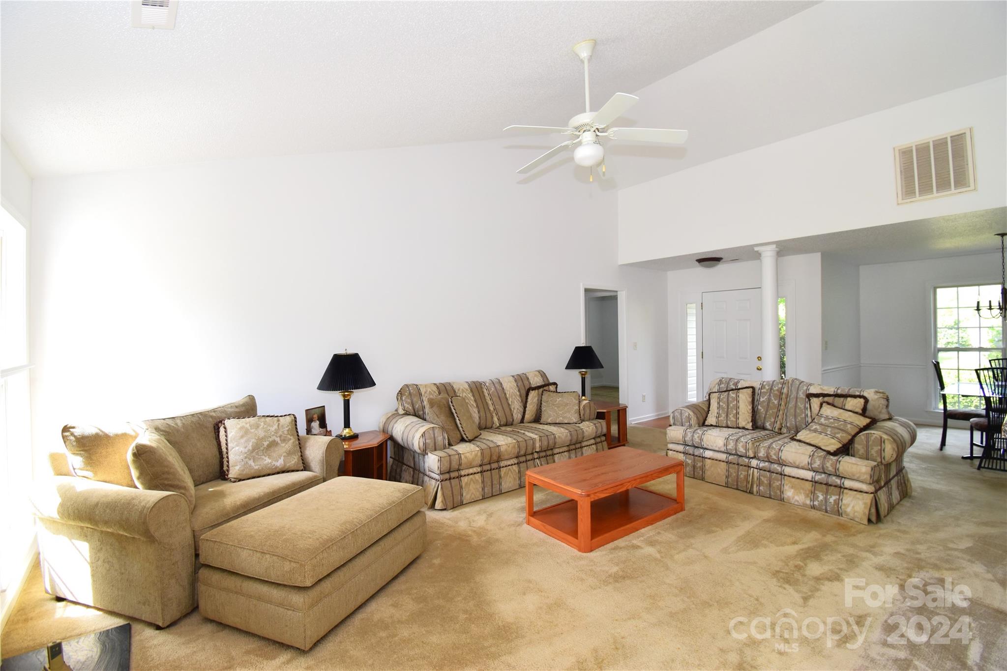 65 Cottage Ridge Road Fletcher, NC 28732 - Photo 2 of 40 a living room with furniture and a chandelier
