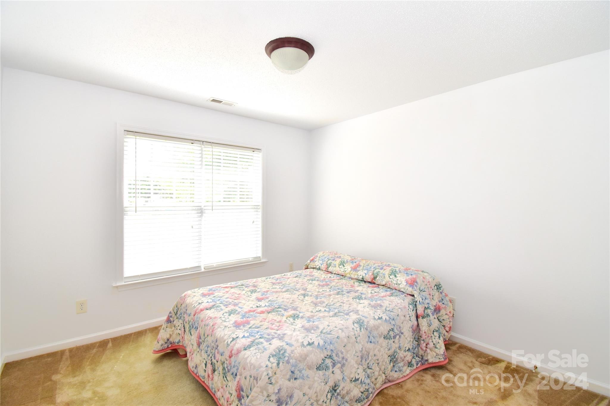 65 Cottage Ridge Road Fletcher, NC 28732 - Photo 22 of 40 a bedroom with a bed and a window
